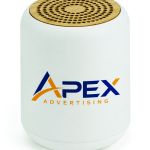 White recycled-plastic Bluetooth speaker with a circular bamboo grille, control buttons, charging port and 3.5 mm AUX input.
