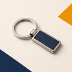 Silver metal keychain with a navy PU leather insert.