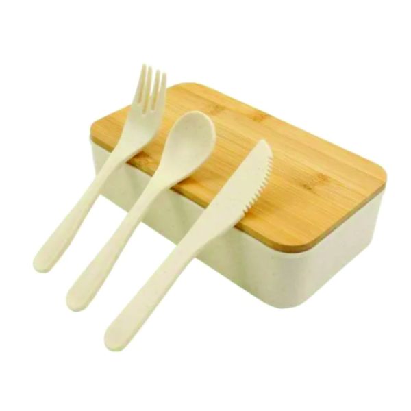 Beige two-tier lunch box with a natural bamboo lid displayed with matching reusable fork, spoon and knife.