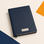 Navy PU leather A5 notebook with a silver branding plate.