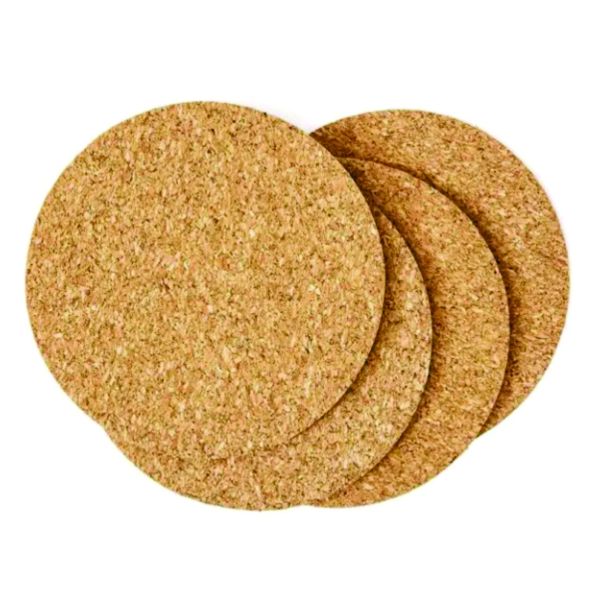 Four plain round natural cork coasters displayed in an overlapping arrangement on a white background.