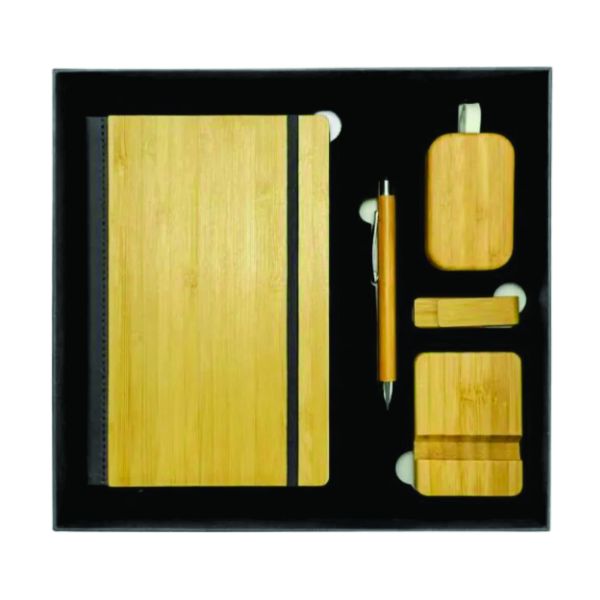 Top view of a five-piece bamboo corporate gift set containing an A5 notebook, stylus pen, Bluetooth earbuds, 16GB USB drive and mobile-phone stand.
